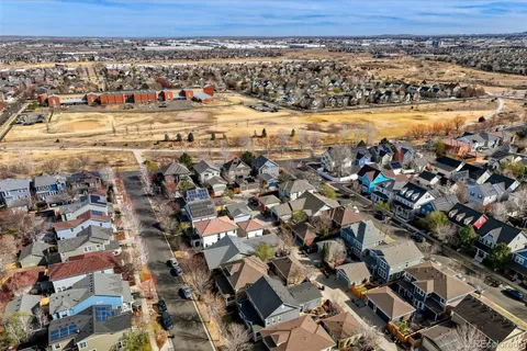 an aerial view of a house with yard swimming pool and outdoor space