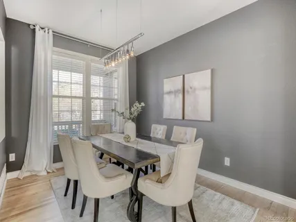 a view of a dining room with furniture and window