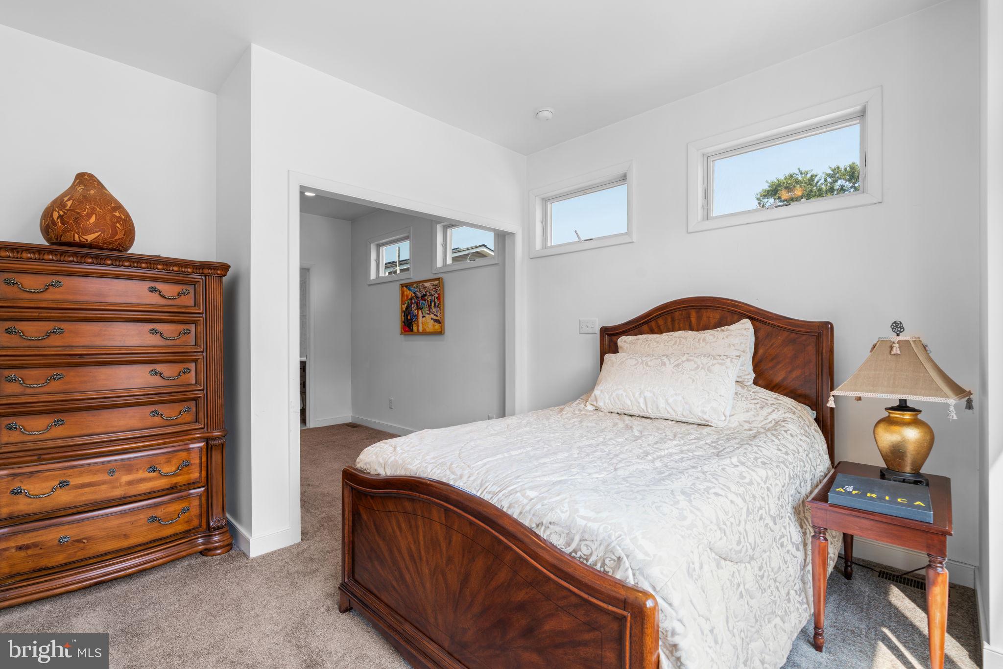 370 Magothy Road Severna Park, MD 21146 - Photo 19 of 64 a bedroom with a bed and wooden floor