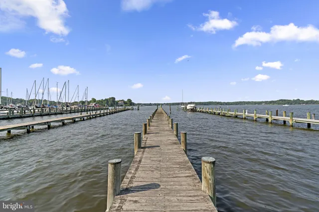 an aerial view of a residential building with yard
