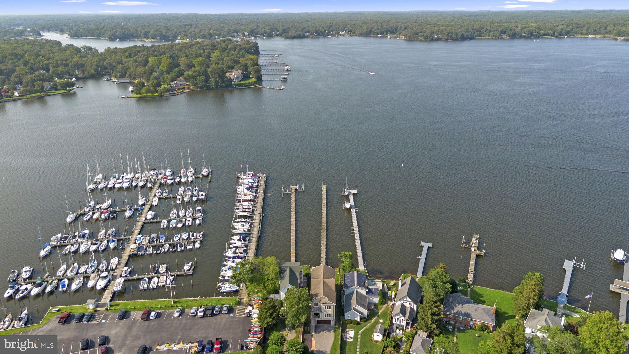 370 Magothy Road Severna Park, MD 21146 - Photo 45 of 64 a view of a lake with a building in the background