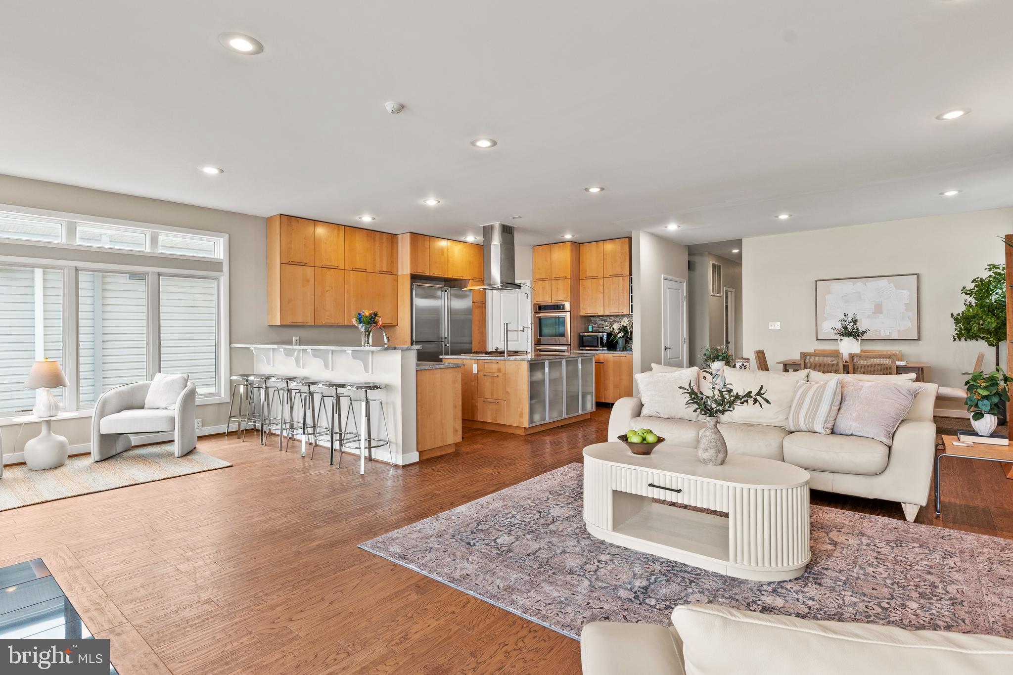 370 Magothy Road Severna Park, MD 21146 - Photo 6 of 64 a living room with couches and kitchen view with wooden floor