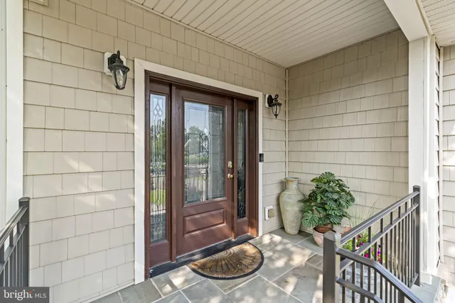 a kitchen with a stove and a wooden floor