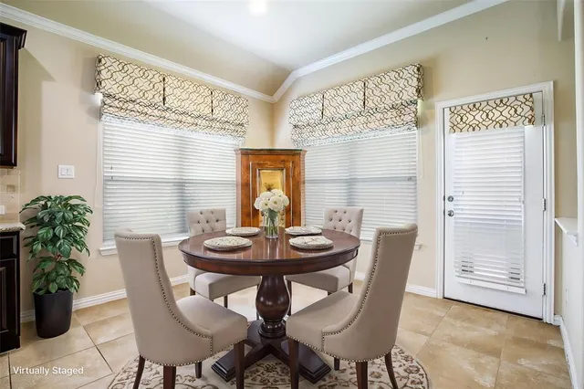 a dining room with furniture and window