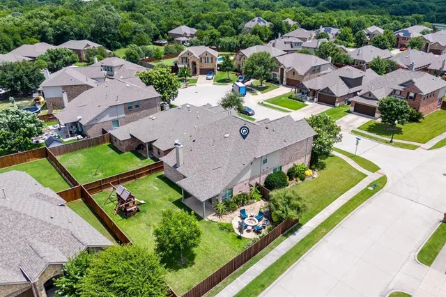 an aerial view of a house with a garden