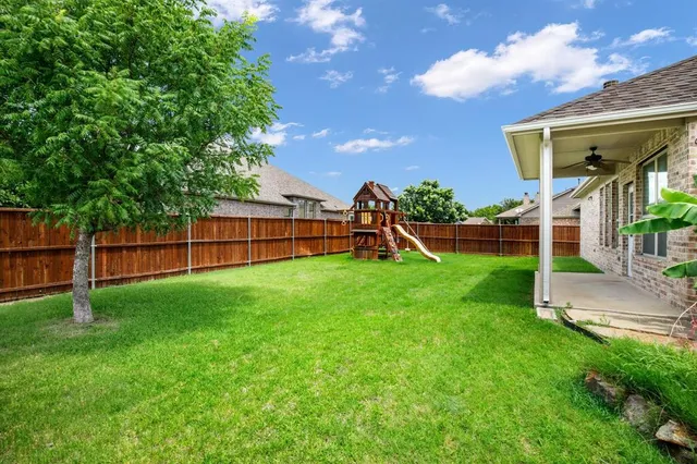 a view of a backyard with a garden