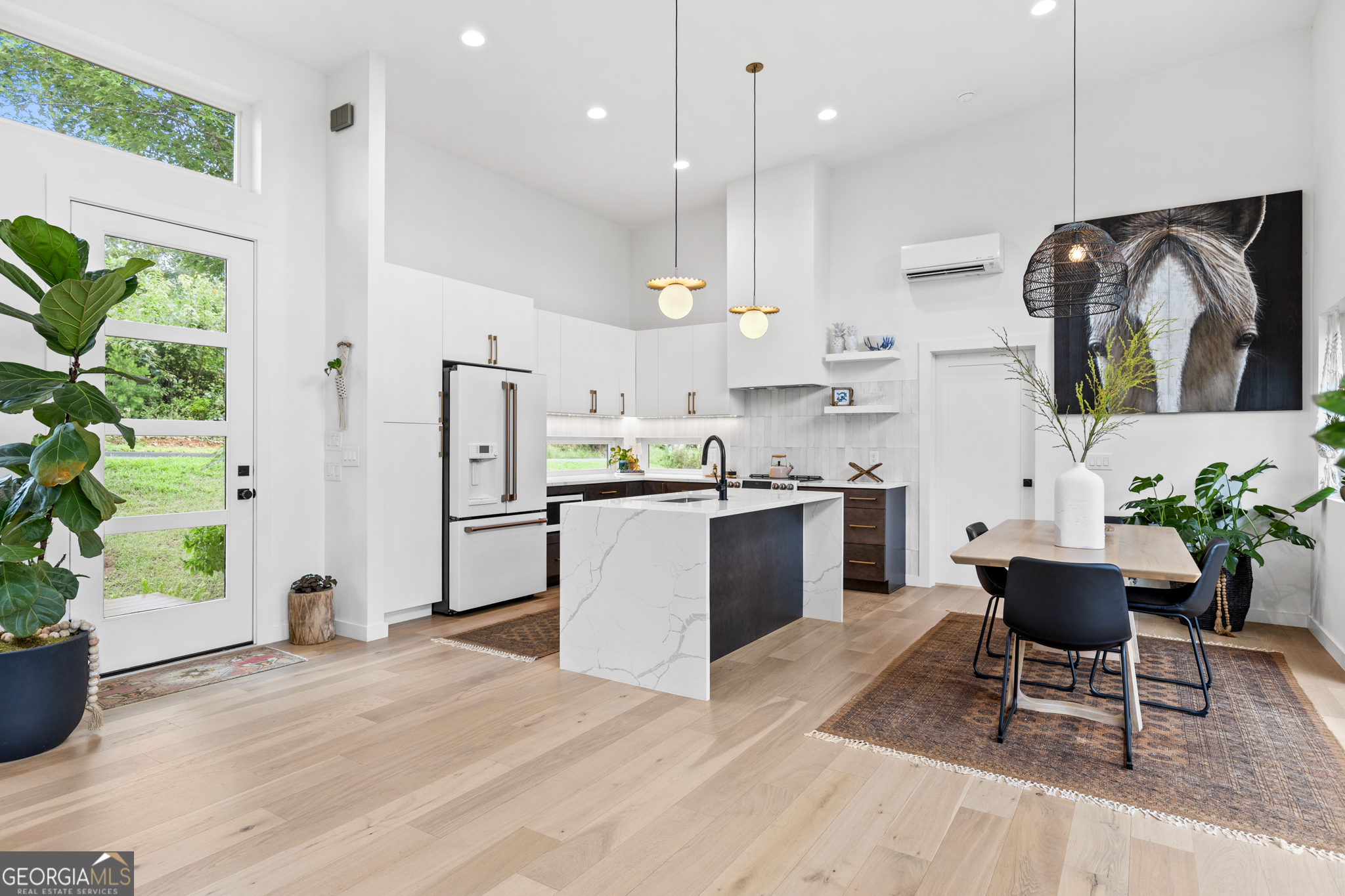 21 That Way Young Harris, GA 30582 - Photo 12 of 60 a kitchen with stainless steel appliances kitchen island granite countertop a refrigerator a sink a stove and a oven with wooden floor