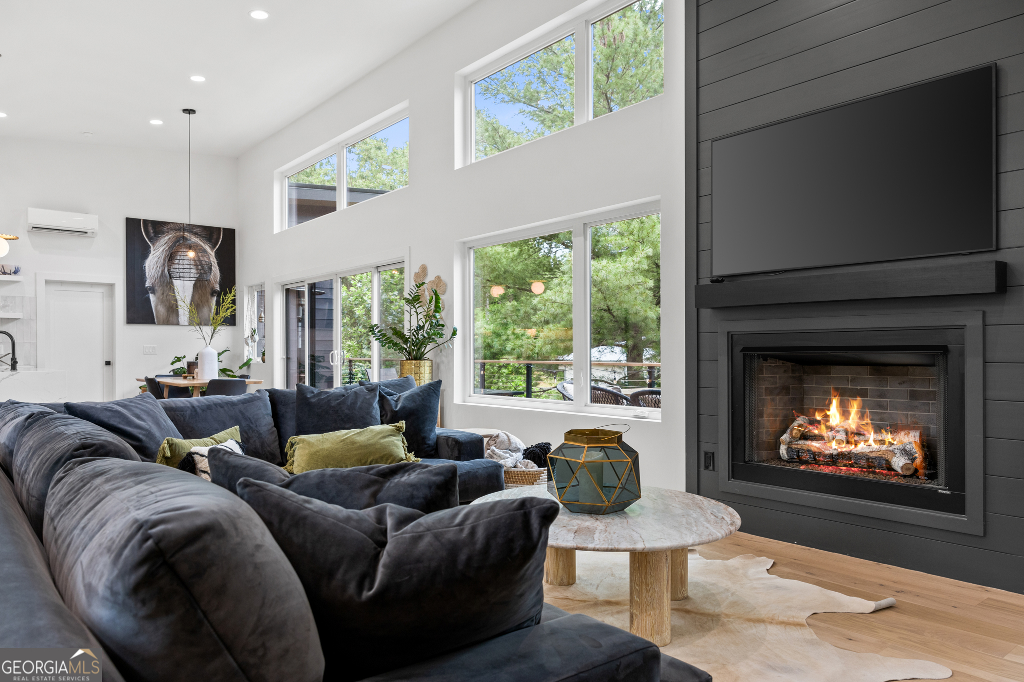 21 That Way Young Harris, GA 30582 - Photo 21 of 60 a living room with furniture a fireplace and a flat screen tv