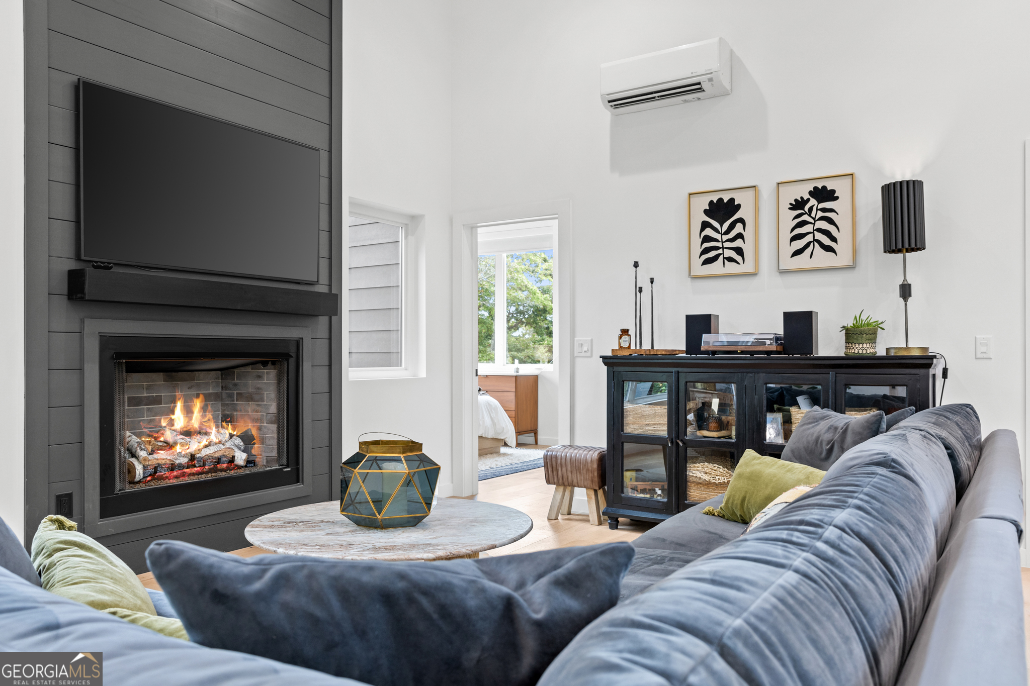 21 That Way Young Harris, GA 30582 - Photo 22 of 60 a living room with furniture a fireplace and a flat screen tv