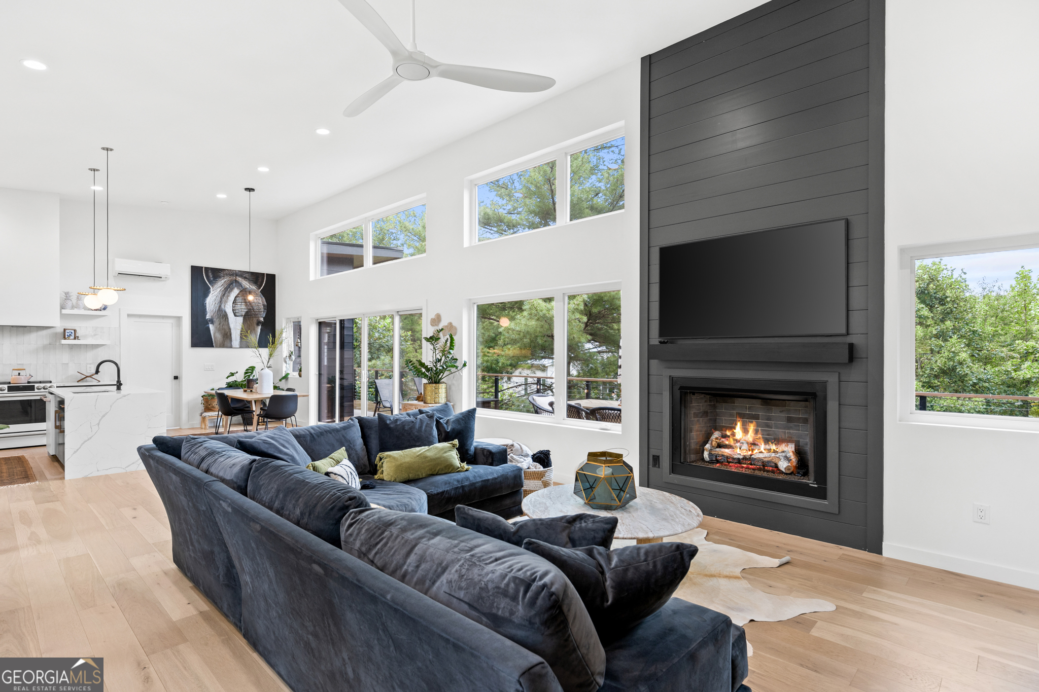 21 That Way Young Harris, GA 30582 - Photo 23 of 60 a living room with furniture a fireplace and a large window