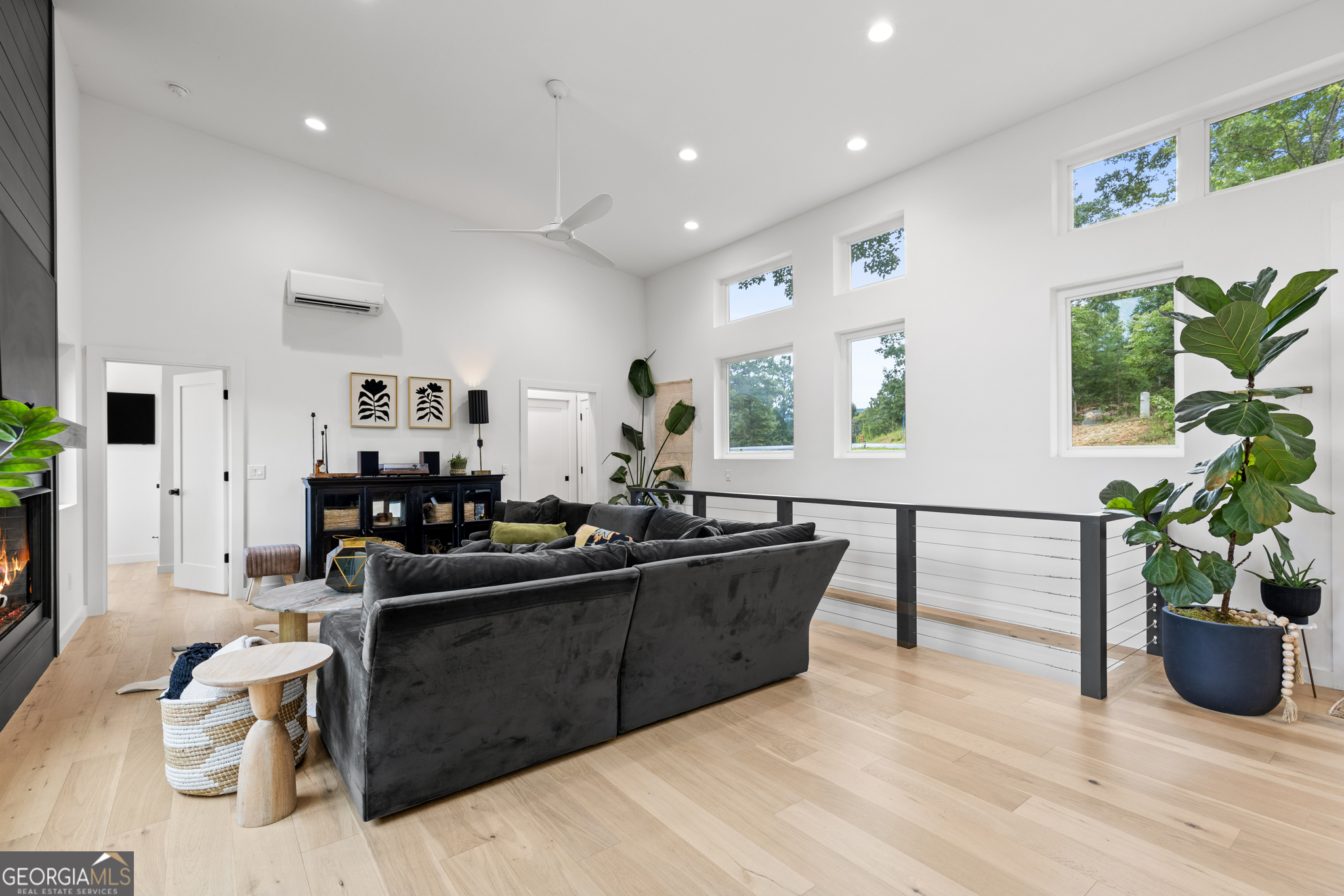 21 That Way Young Harris, GA 30582 - Photo 24 of 60 a living room with furniture windows and potted plants