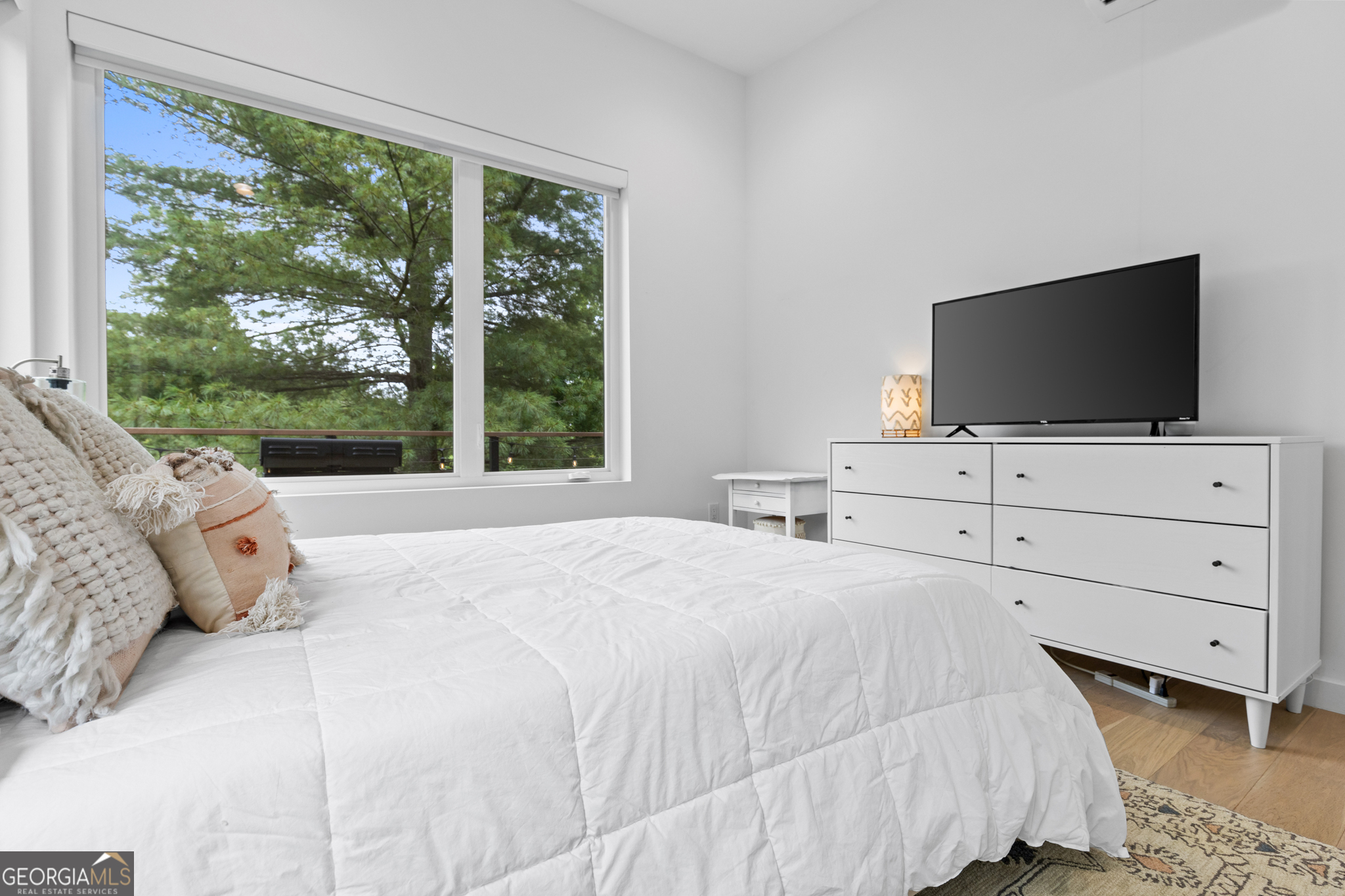 21 That Way Young Harris, GA 30582 - Photo 31 of 60 a bedroom with a bed and a flat screen tv