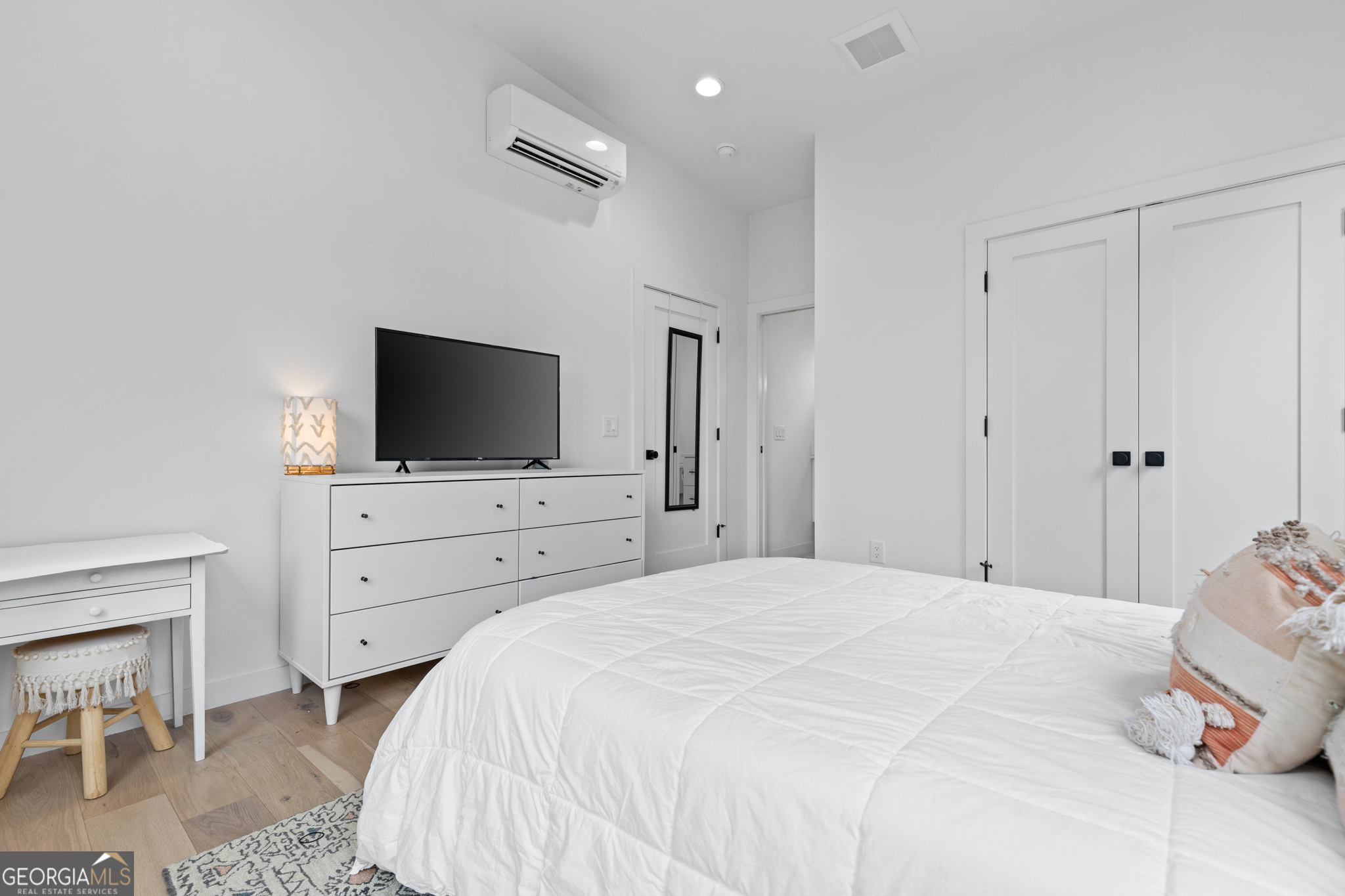 21 That Way Young Harris, GA 30582 - Photo 32 of 60 a bedroom with a bed and a flat screen tv