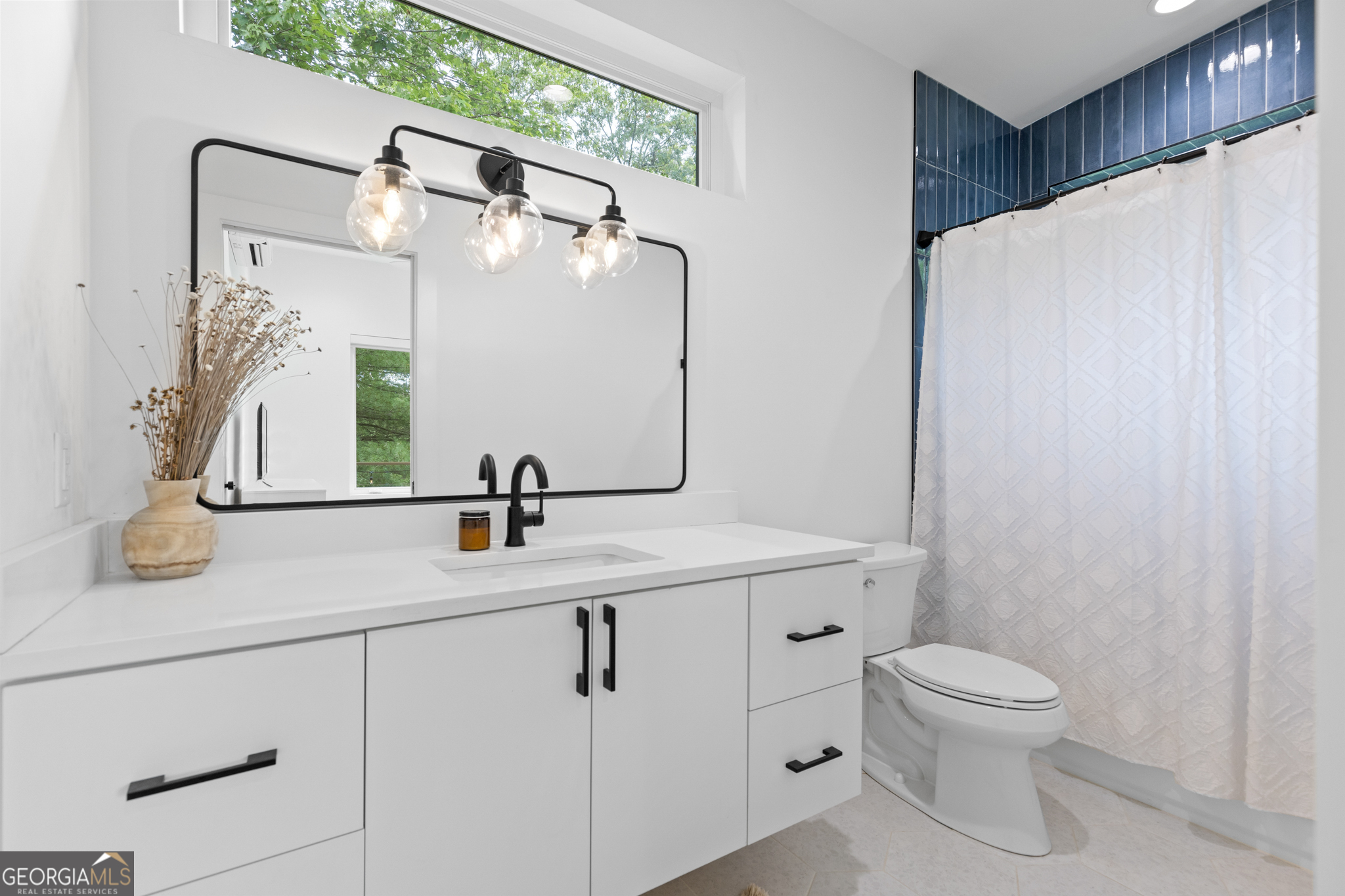 21 That Way Young Harris, GA 30582 - Photo 33 of 60 a bathroom with a toilet sink and mirror