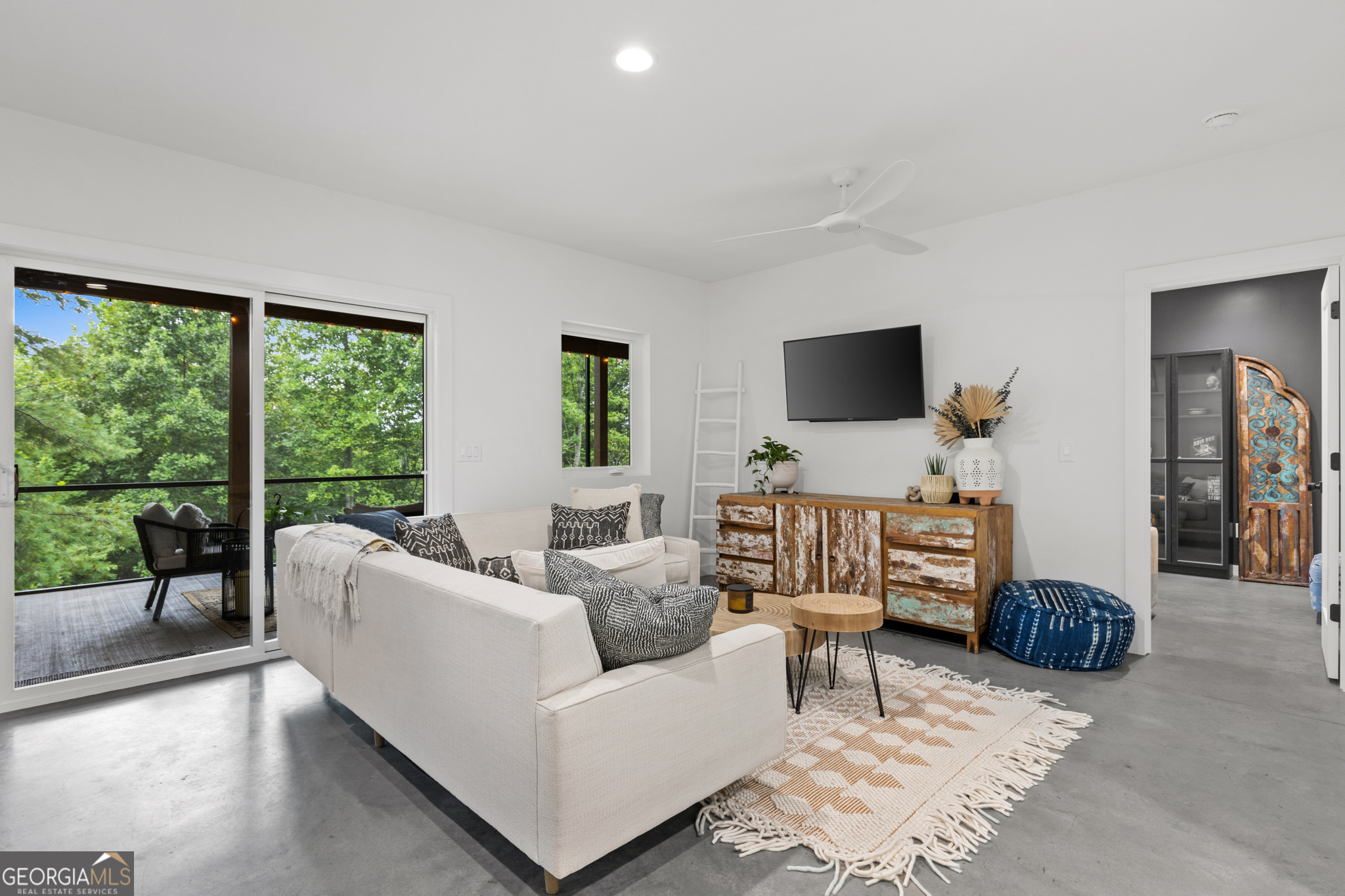21 That Way Young Harris, GA 30582 - Photo 38 of 60 a living room with furniture and large windows