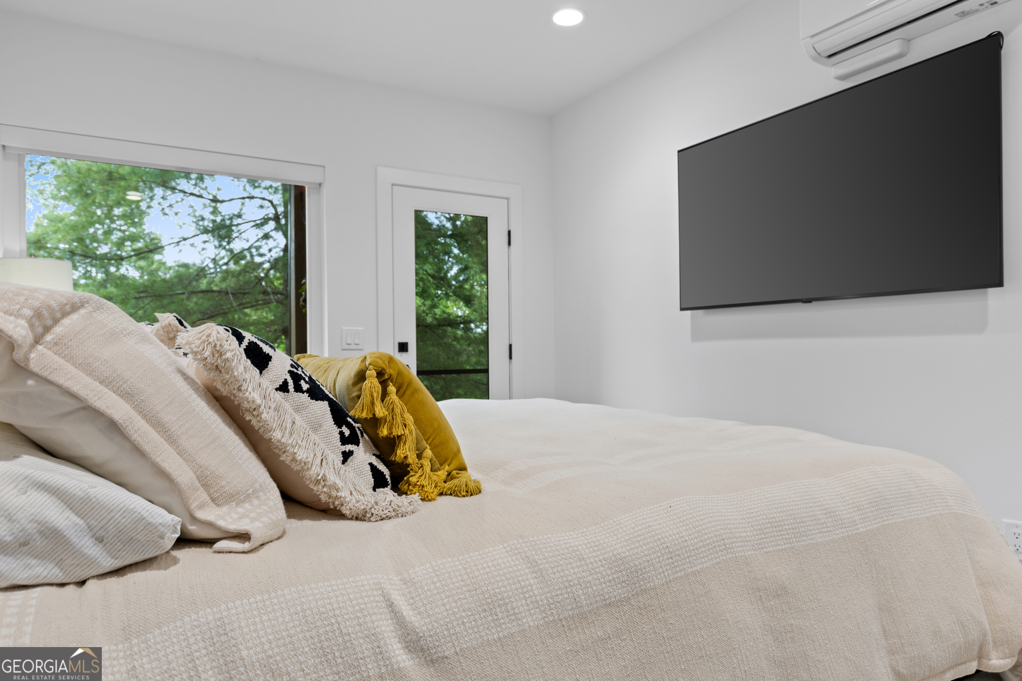 21 That Way Young Harris, GA 30582 - Photo 46 of 60 a bed sitting in a bedroom next to a window