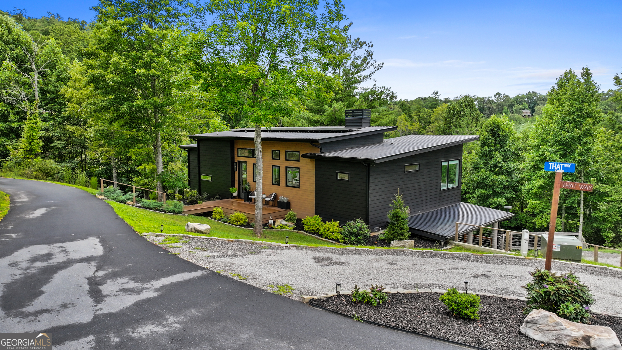21 That Way Young Harris, GA 30582 - Photo 54 of 60 a front view of a house with a yard and potted plants