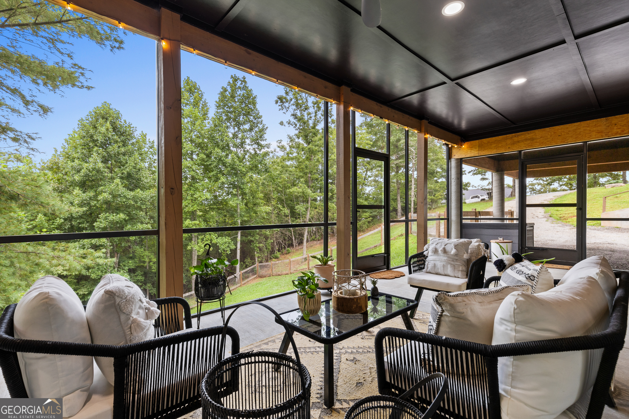 21 That Way Young Harris, GA 30582 - Photo 6 of 60 a living room with furniture and floor to ceiling windows