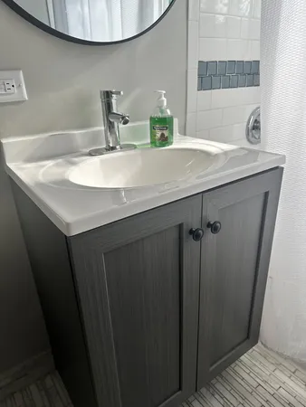 a bathroom with a sink and a mirror