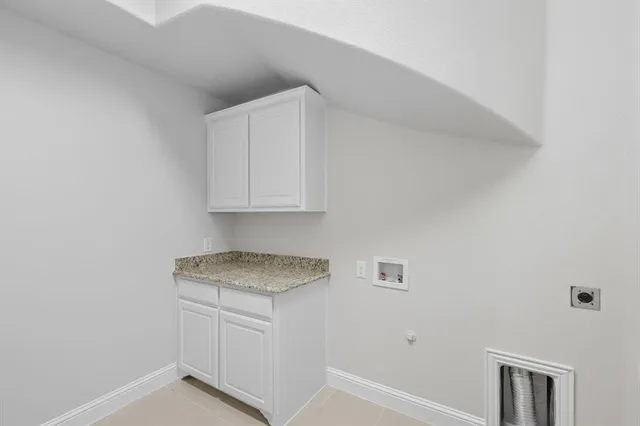 a kitchen with white cabinets