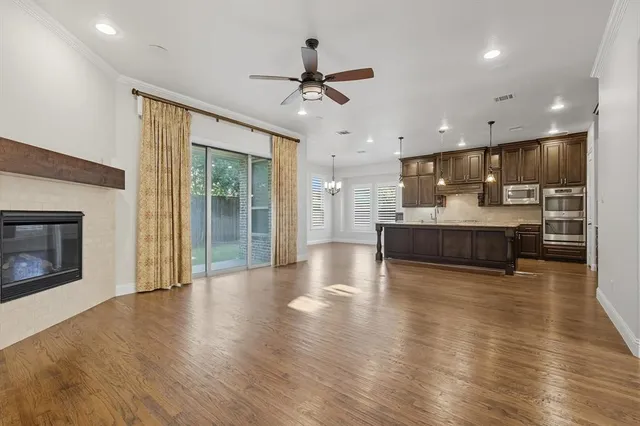 a view of kitchen and kitchen with furniture wooden floor and window