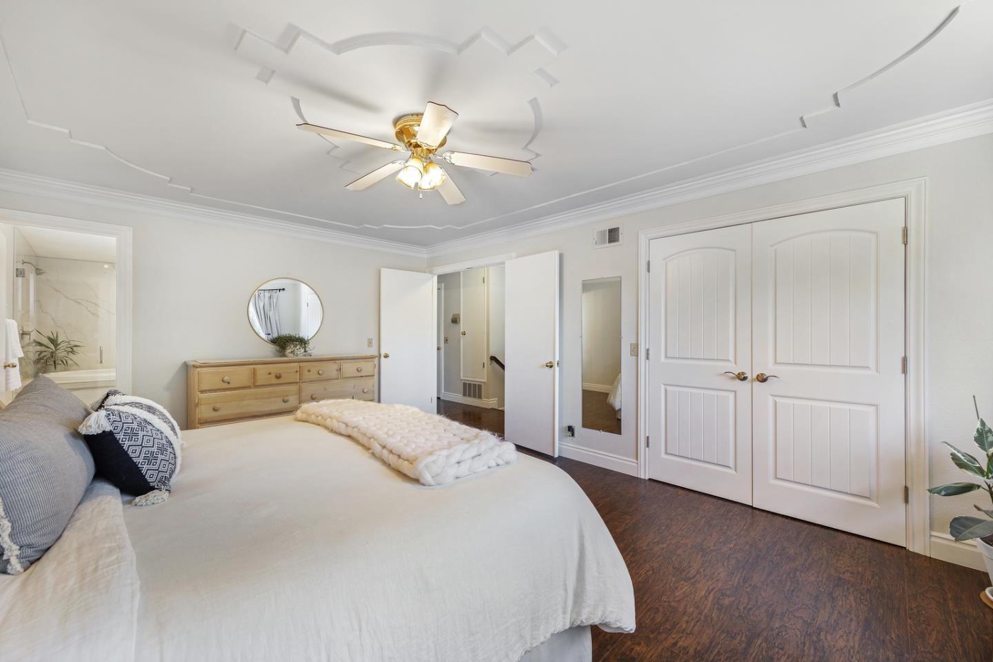 6479 Barron Place Gilroy, CA 95020 - Photo 12 of 26 a bedroom with a bed and a chandelier