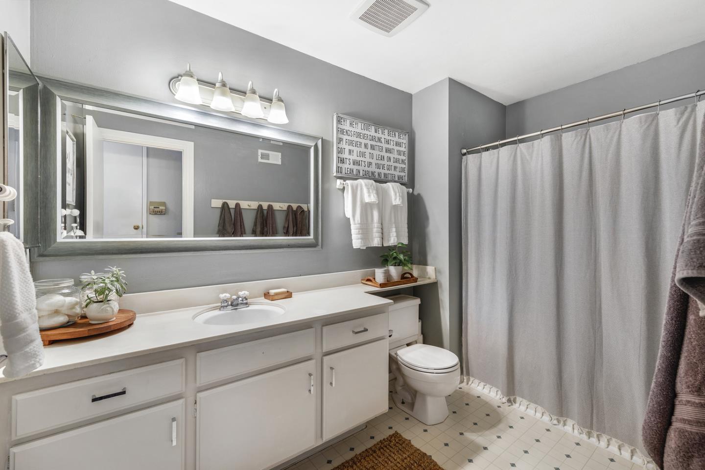 6479 Barron Place Gilroy, CA 95020 - Photo 16 of 26 a bathroom with a sink a toilet and mirror