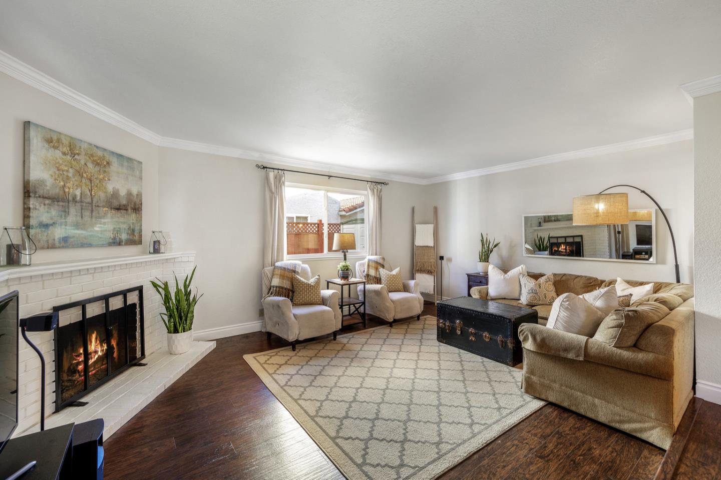 6479 Barron Place Gilroy, CA 95020 - Photo 2 of 26 a living room with furniture and a fireplace