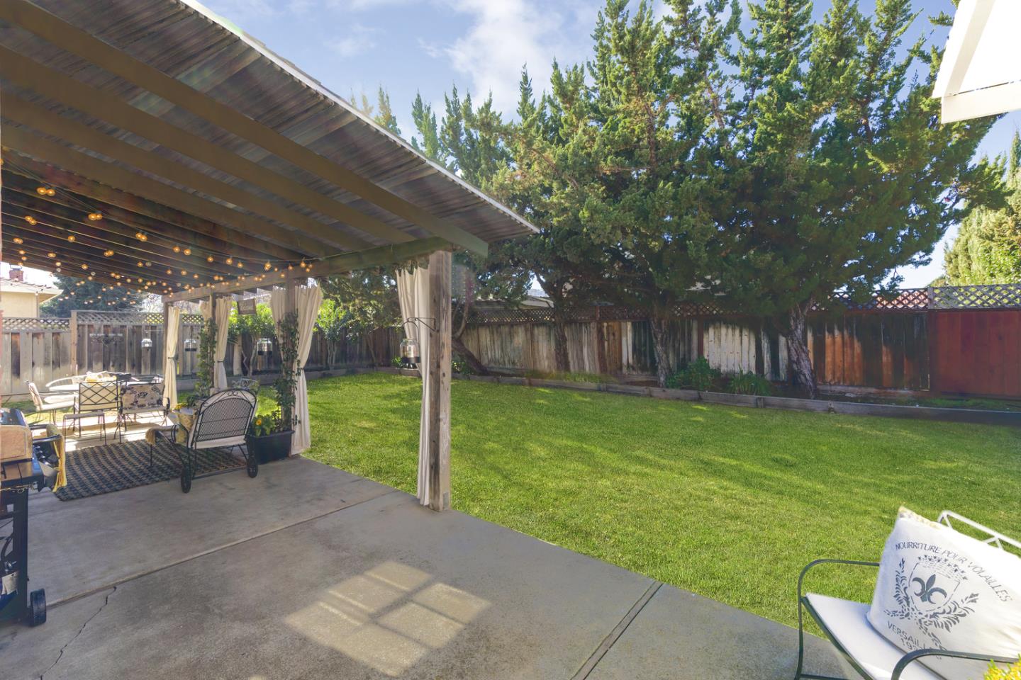 6479 Barron Place Gilroy, CA 95020 - Photo 21 of 26 a view of a patio with couches chairs and a big yard