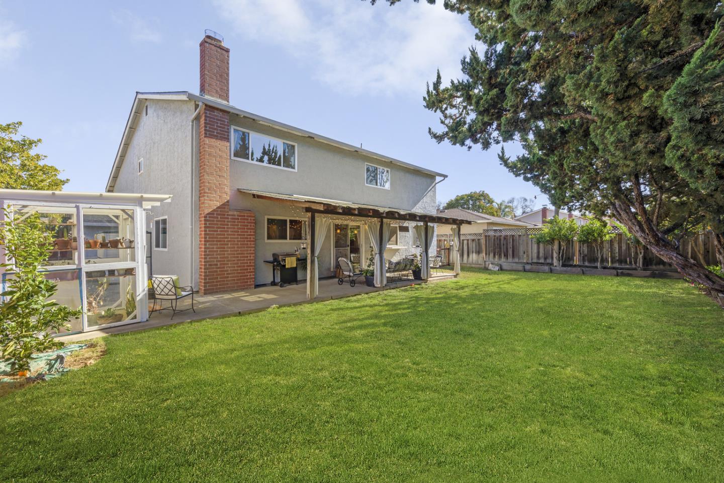 6479 Barron Place Gilroy, CA 95020 - Photo 23 of 26 a front view of a house with a garden
