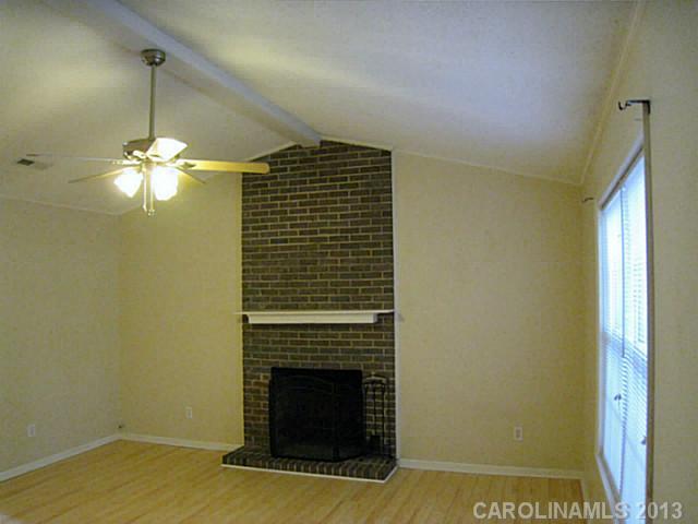 4242 Sudbury Road Charlotte, NC 28205 - Photo 1 of 16 a view of a livingroom with a fireplace
