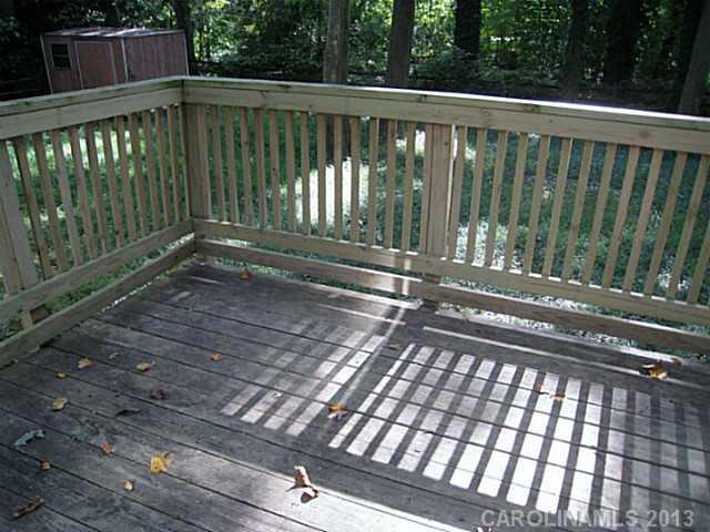 4242 Sudbury Road Charlotte, NC 28205 - Photo 13 of 16 a view of outdoor space with deck and yard