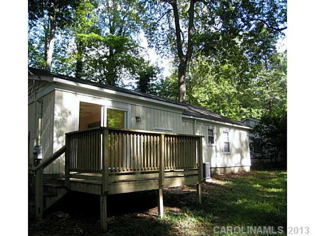 4242 Sudbury Road Charlotte, NC 28205 - Photo 14 of 16 a view of backyard with deck and wooden floor