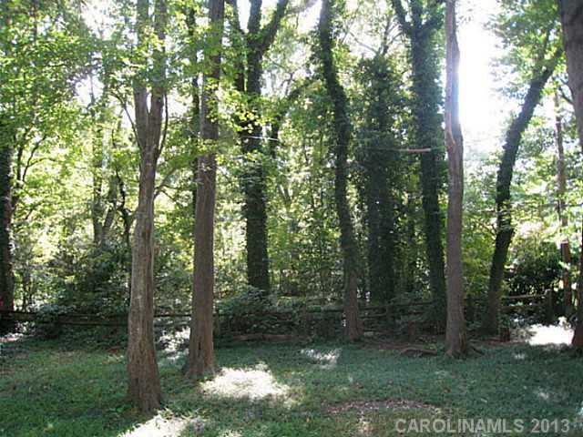 4242 Sudbury Road Charlotte, NC 28205 - Photo 15 of 16 a backyard of a house with lots of green space