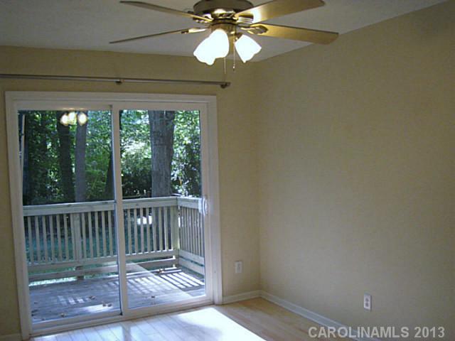 4242 Sudbury Road Charlotte, NC 28205 - Photo 6 of 16 a view of a balcony with wooden floor