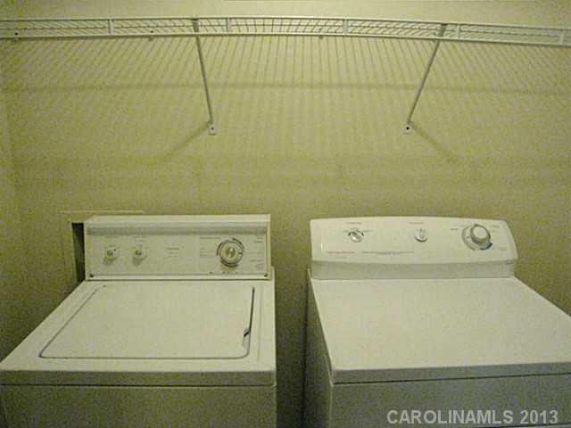 4242 Sudbury Road Charlotte, NC 28205 - Photo 7 of 16 a utility room with dryer and washer