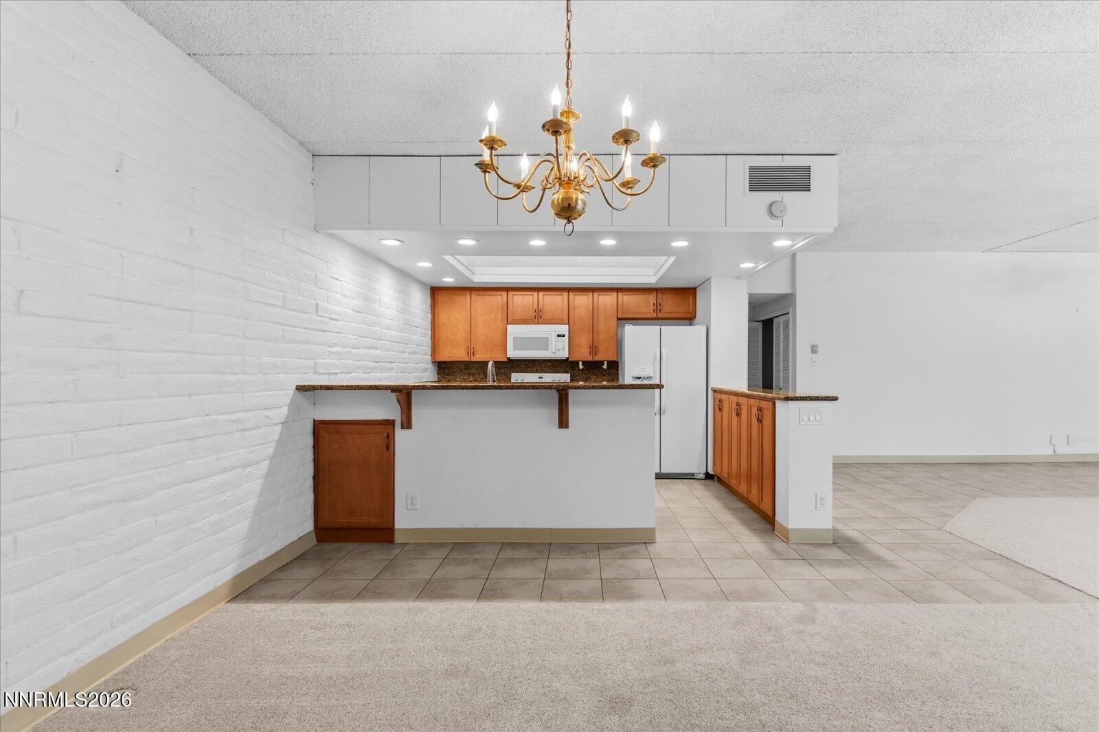 1200 Riverside Drive, Unit 1229 Reno, NV 89503 - Photo 24 of 51 a view of a kitchen with a sink and dishwasher