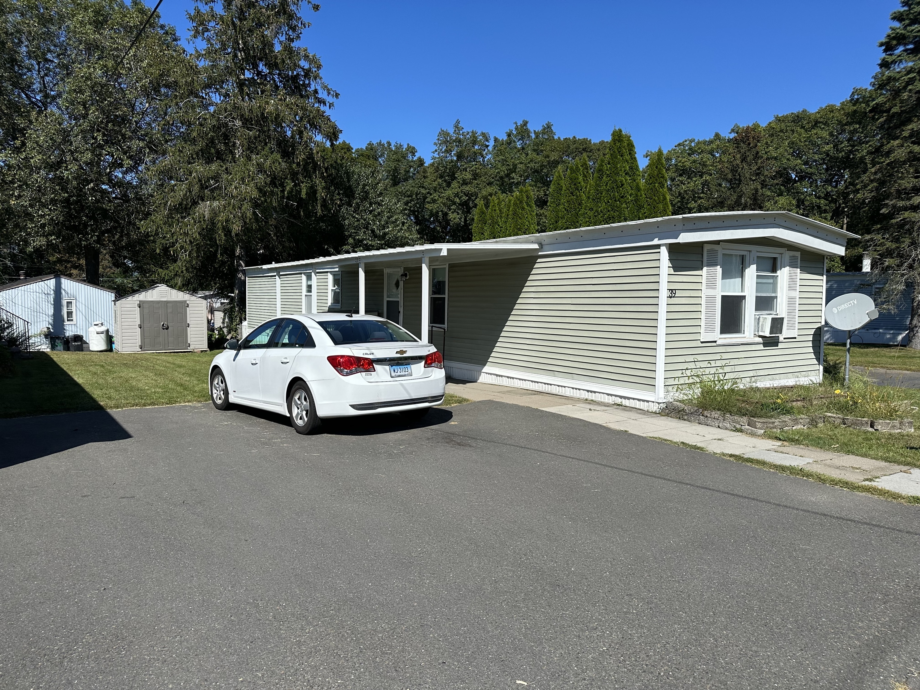 39 Shadduck Road Naugatuck, CT 06770 - Photo 1 of 1 a car parked on the side of a road