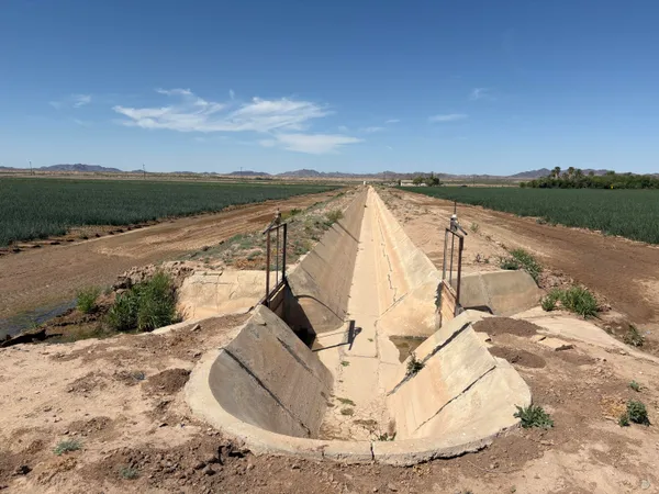 a view of a lake in middle of the road