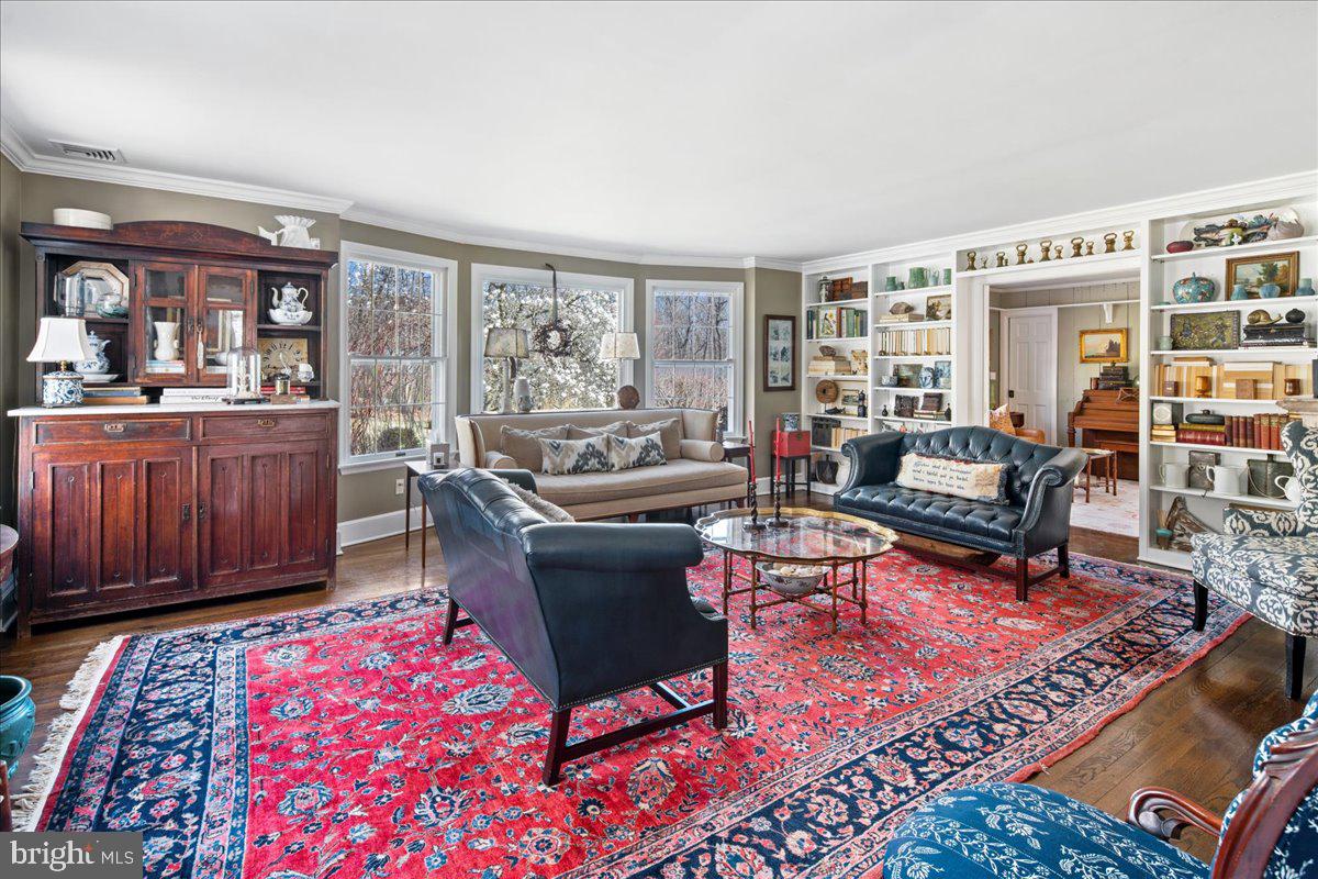 1781 Stuart Road West Princeton, NJ 08540 - Photo 11 of 57 Living room with fireplace and large windows.
