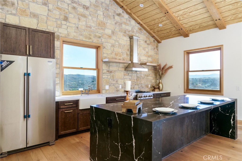 37219 Quarter Valley Road Temecula, CA 92592 - Photo 13 of 51 a kitchen with sink refrigerator and window