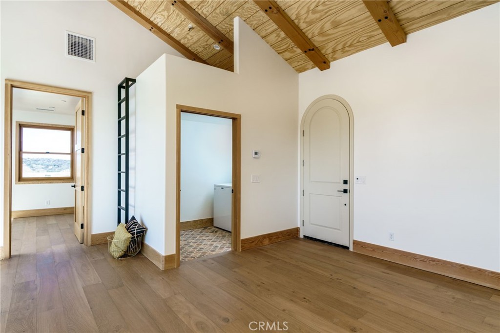 37219 Quarter Valley Road Temecula, CA 92592 - Photo 16 of 49 View of the front door, laundry room, sleeping area on top of laundry room, and bedroom door