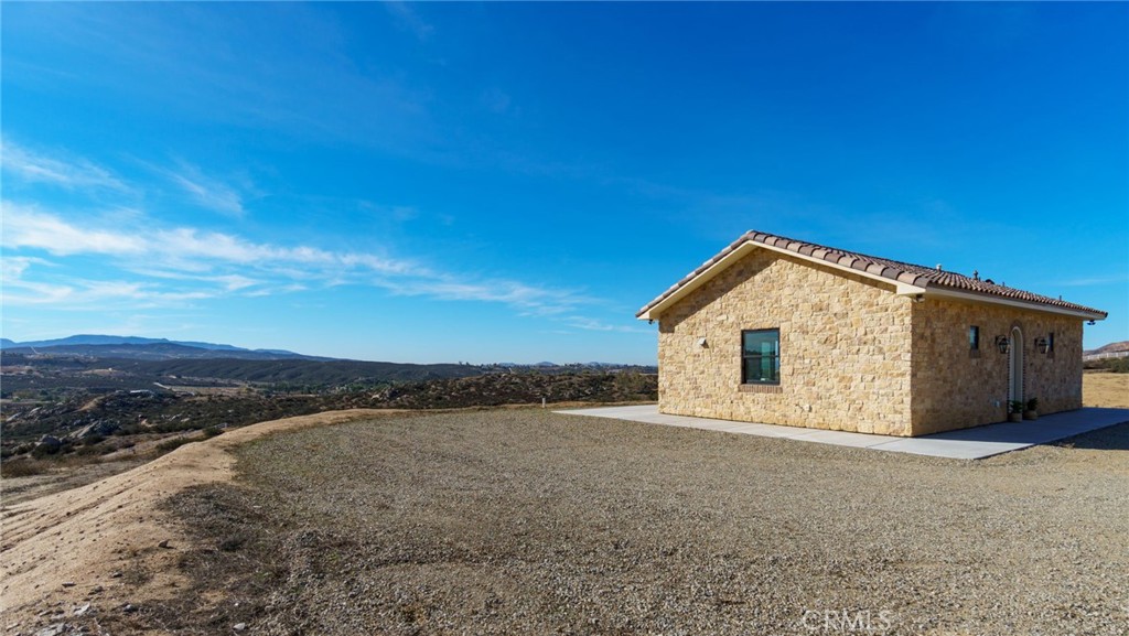 37219 Quarter Valley Road Temecula, CA 92592 - Photo 2 of 51 a view of a house with a backyard