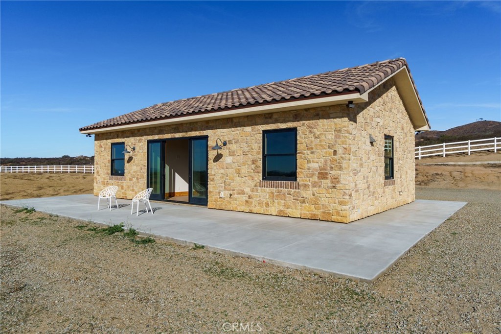 37219 Quarter Valley Road Temecula, CA 92592 - Photo 30 of 51 a front view of a house with garden
