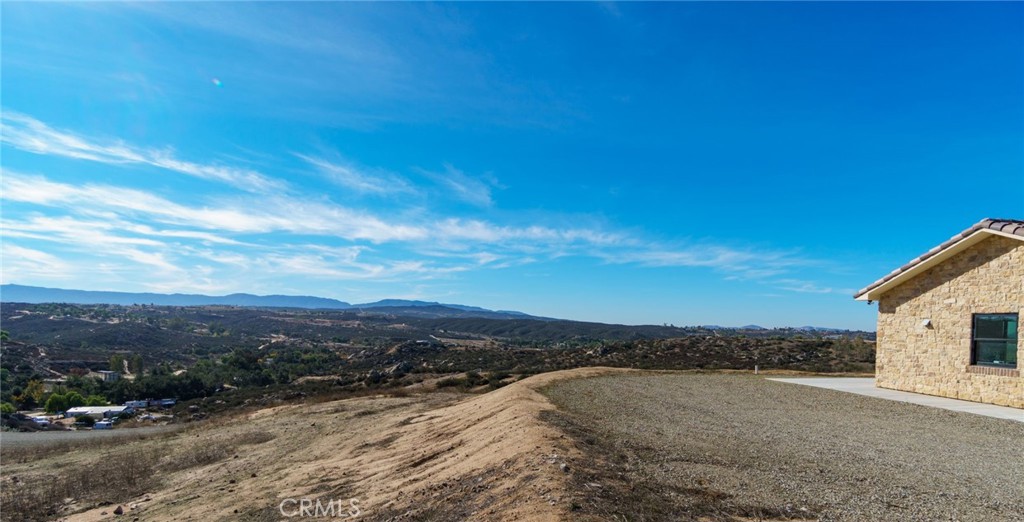 37219 Quarter Valley Road Temecula, CA 92592 - Photo 37 of 51 a view of a road with a building in the background