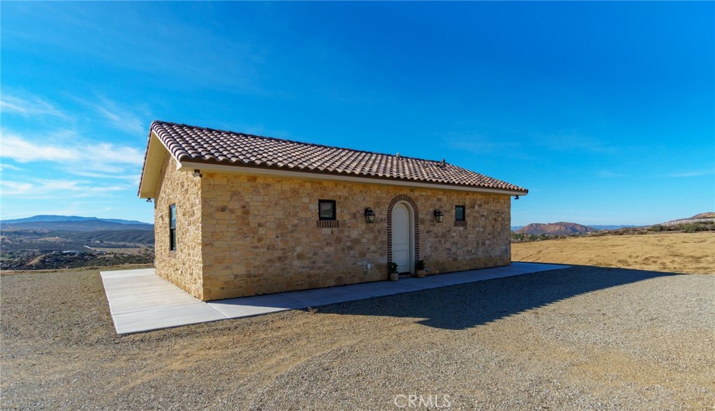 37219 Quarter Valley Road Temecula, CA 92592 - Photo 4 of 51 a front view of a house with beach