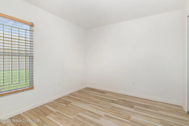 a view of a room that has a window in it