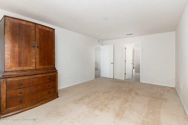 a view of room with closet and cabinet