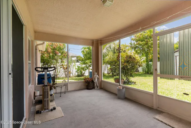 a view of an empty room with a large window