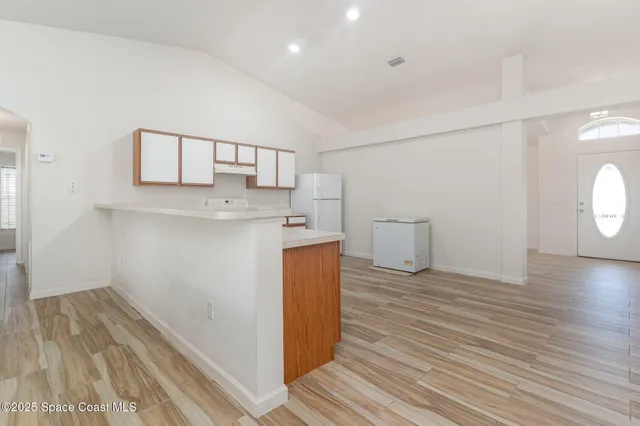 a view of a kitchen with a sink